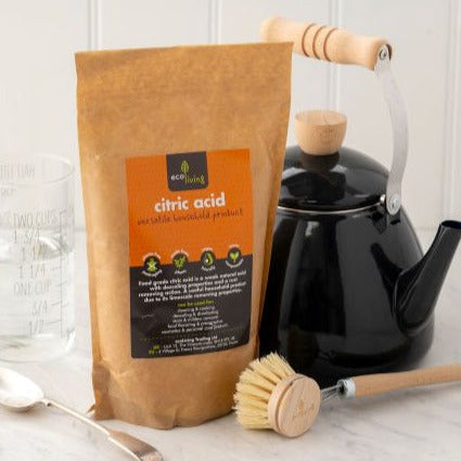 Eco living Citric Acid with black kettle and wooden dish brush